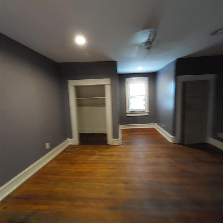 601 Holbrook Street Mount Vernon, TX 75457 - Photo 34 of 35 a view of empty room with wooden floor and fan