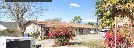 7721 Janet Avenue, Unit 4 Riverside, CA 92503 - Photo 1 of 1 a front view of a house with a yard and a garage