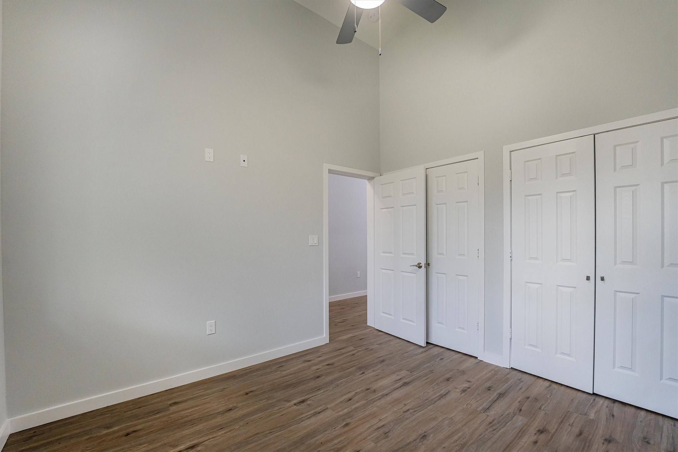 24411 Oakaland Hls Road Point Blank, TX 77364 - Photo 18 of 40 a view of an empty room with wooden floor