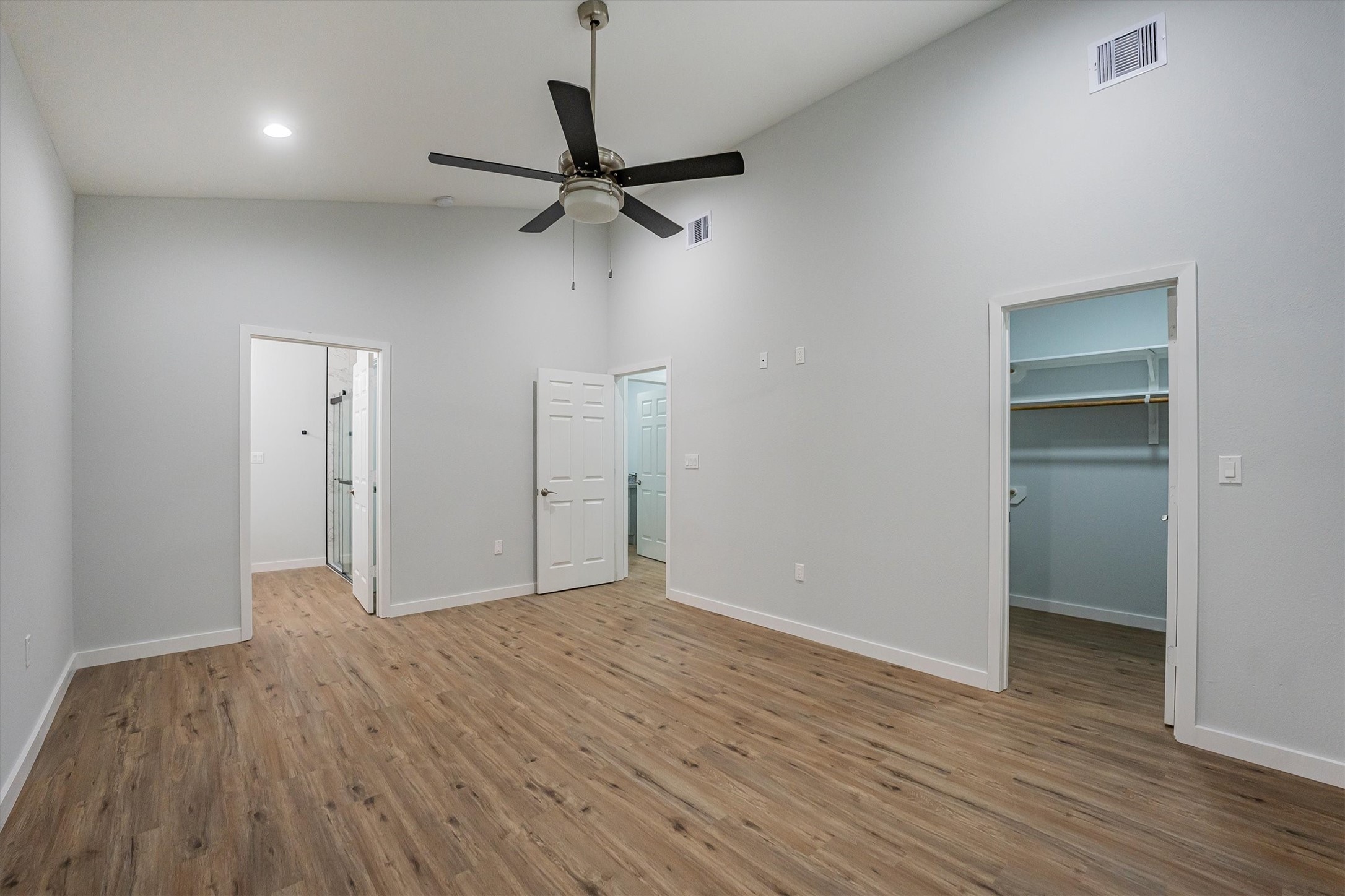 24411 Oakaland Hls Road Point Blank, TX 77364 - Photo 27 of 40 wooden floor in an empty room with a window