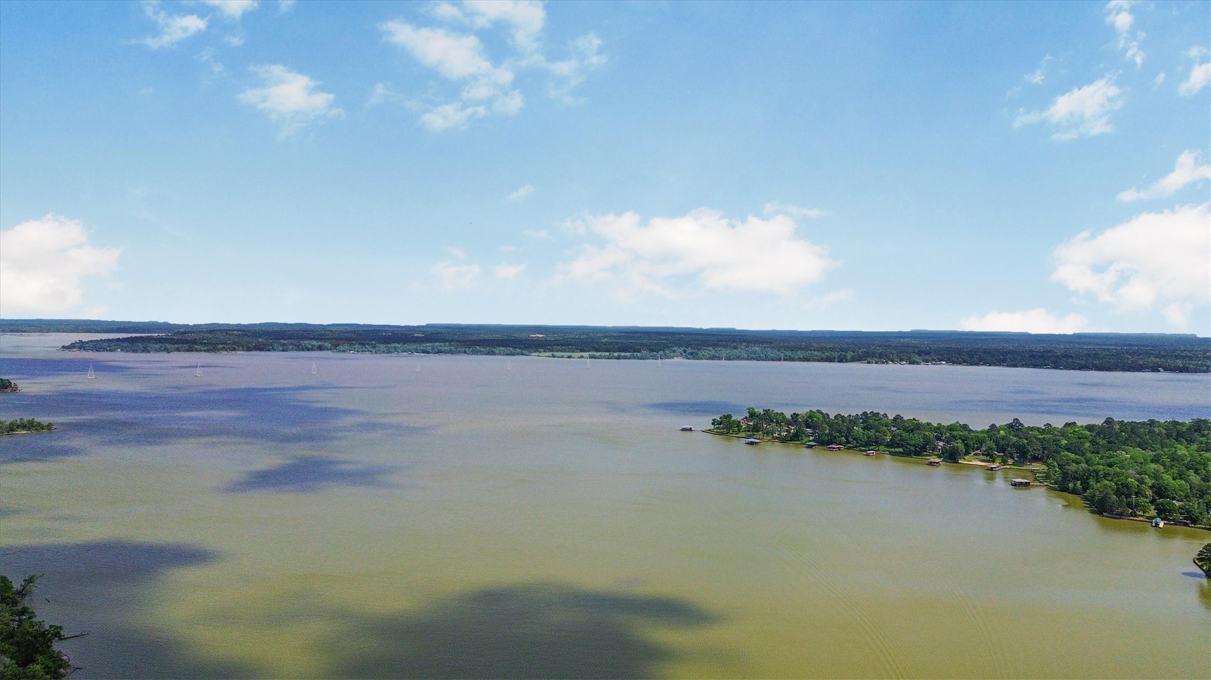 24411 Oakaland Hls Road Point Blank, TX 77364 - Photo 39 of 40 a view of lake and mountain