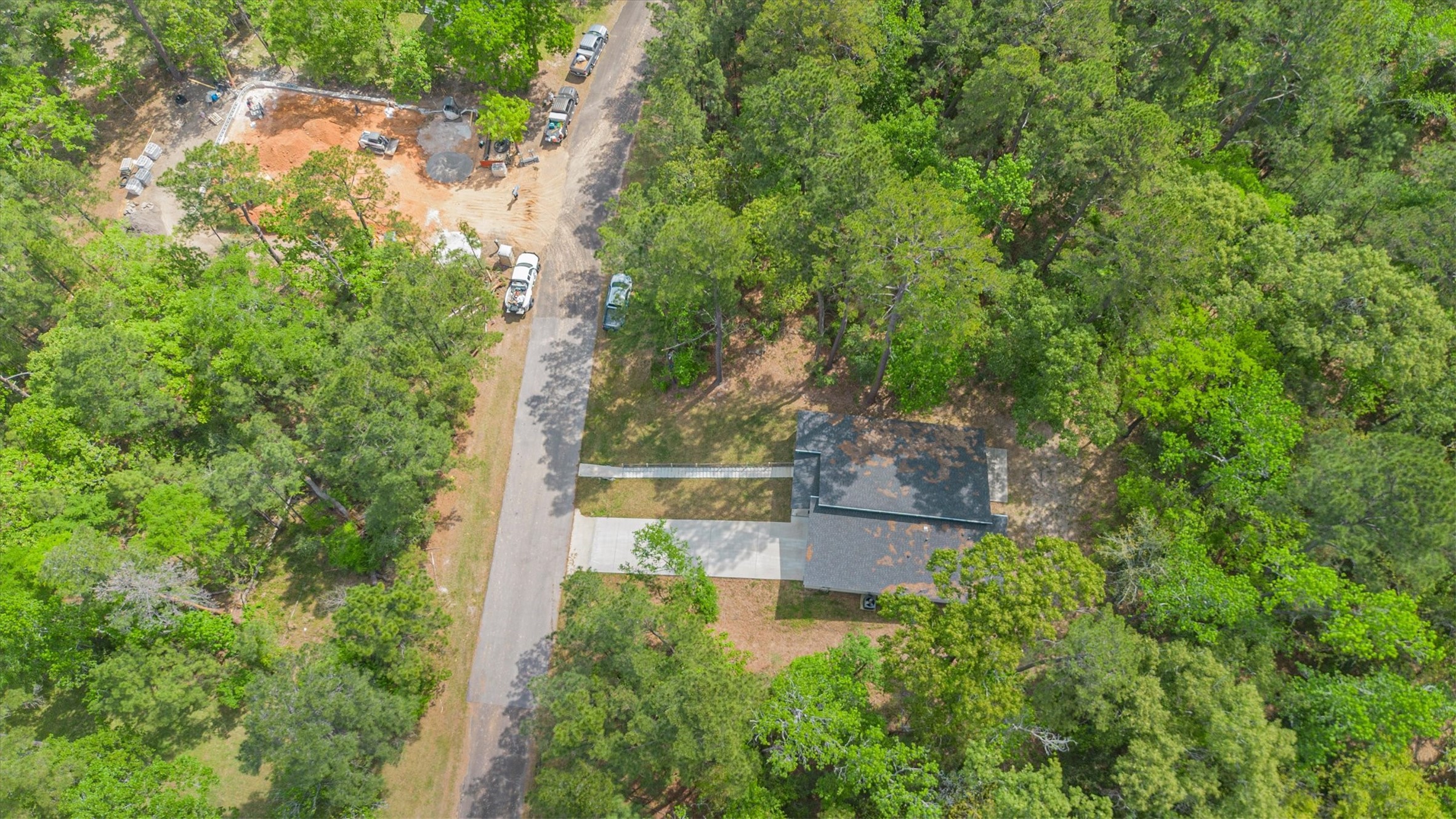 24411 Oakaland Hls Road Point Blank, TX 77364 - Photo 40 of 40 an aerial view of house with yard and outdoor seating