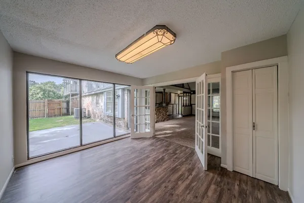 a large kitchen with stainless steel appliances granite countertop a stove a sink and a refrigerator