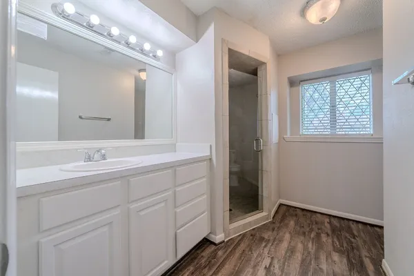 a bathroom with a bathtub and a sink