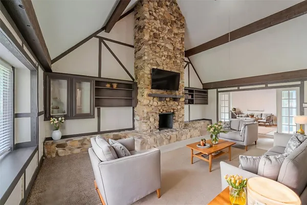 a living room with furniture and a fireplace