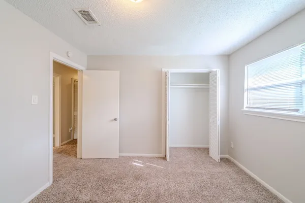 a view of an empty room and window