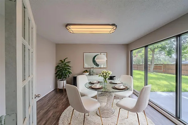 a view of a dining room with furniture window and outside view