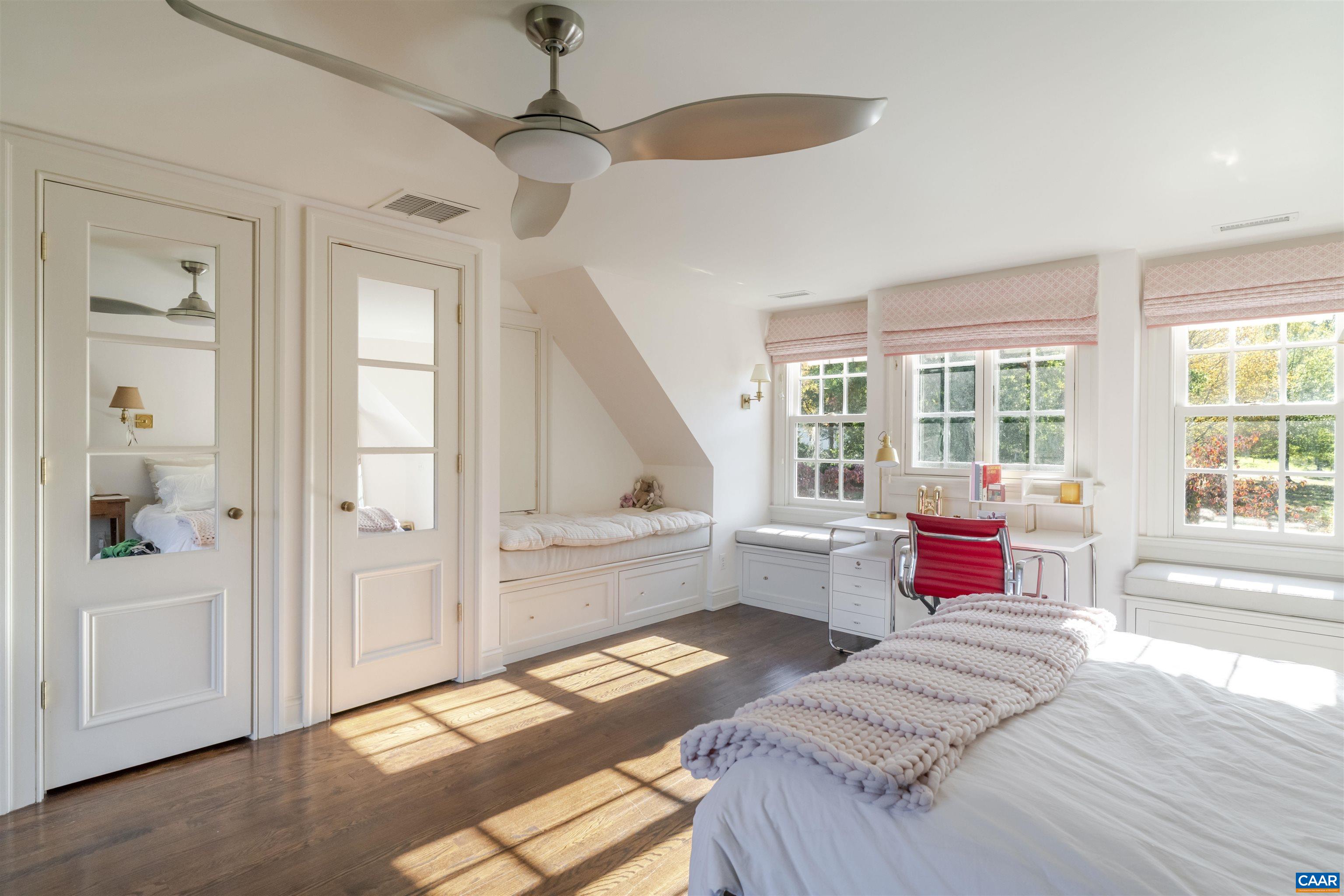 651 Ivy Depot Road Charlottesville, VA 22903 - Photo 36 of 72 a bedroom with a bed and a chandelier
