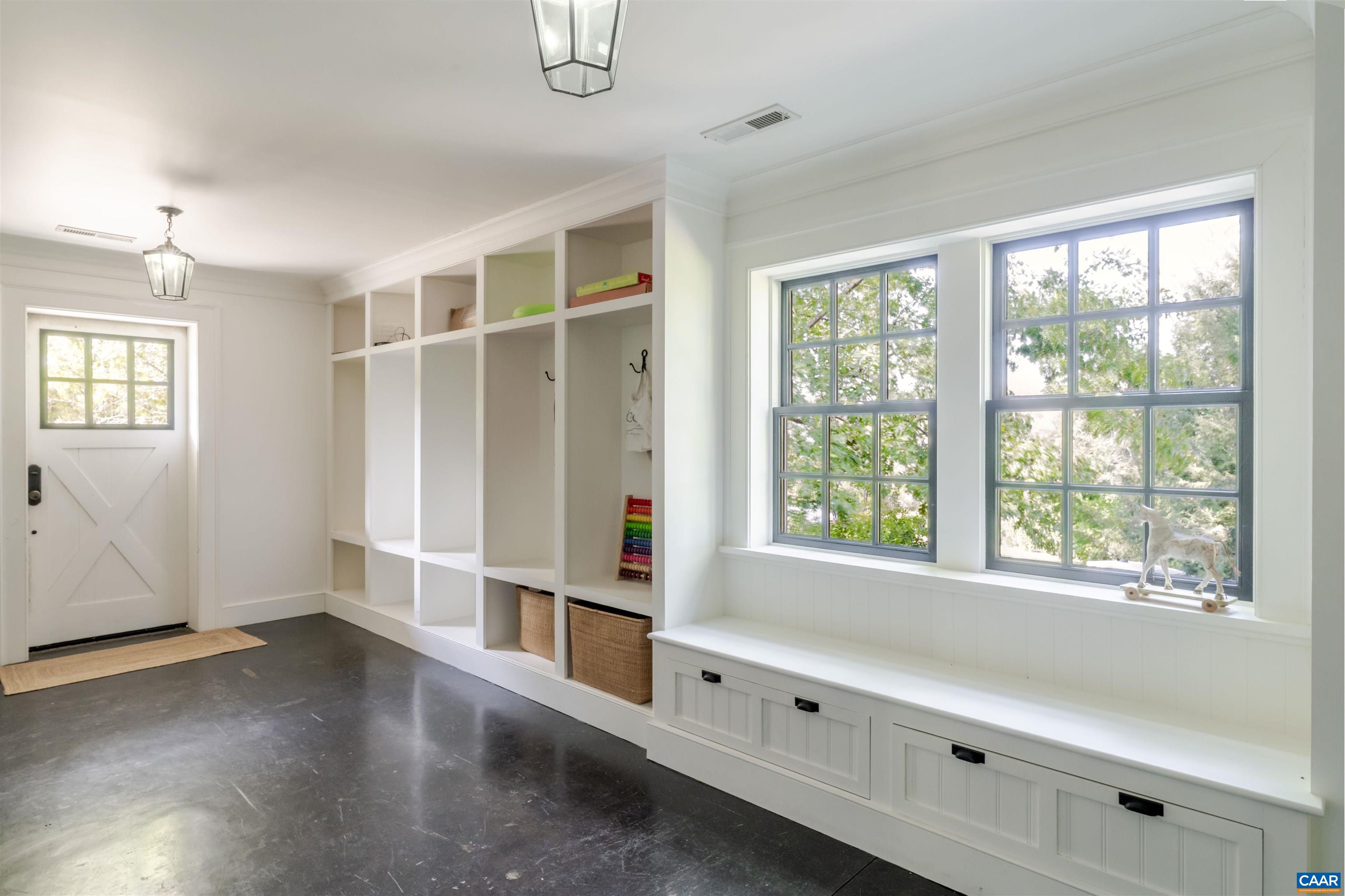 651 Ivy Depot Road Charlottesville, VA 22903 - Photo 53 of 72 a view of an empty room with wooden floor and a window