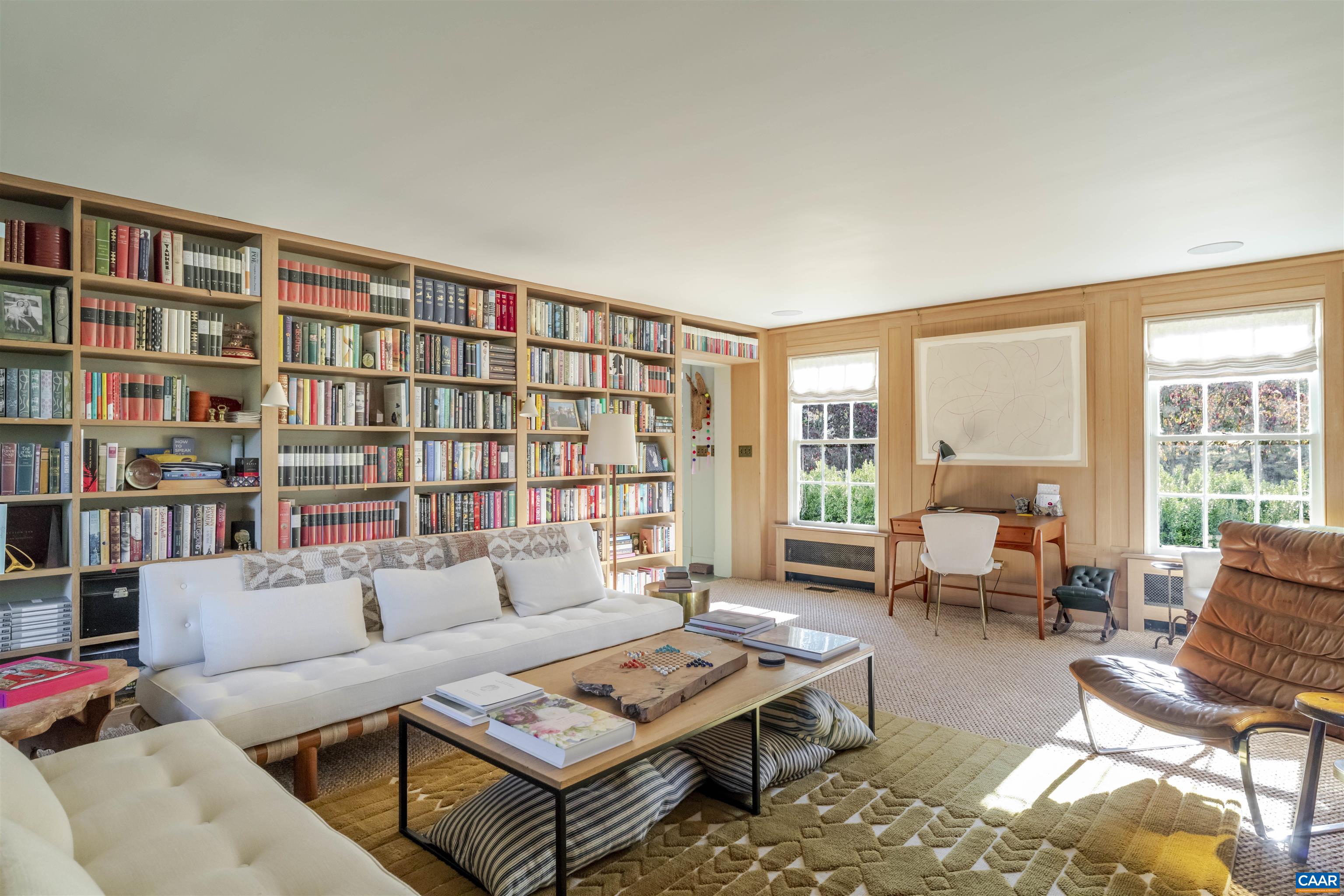 651 Ivy Depot Road Charlottesville, VA 22903 - Photo 7 of 72 a living room with furniture and a book shelf