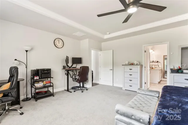 a view of a livingroom with furniture and a workspace