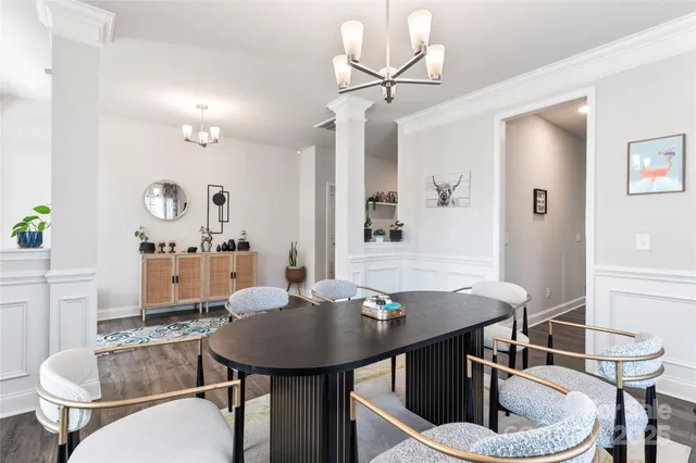 a view of a dining room with furniture and wooden floor