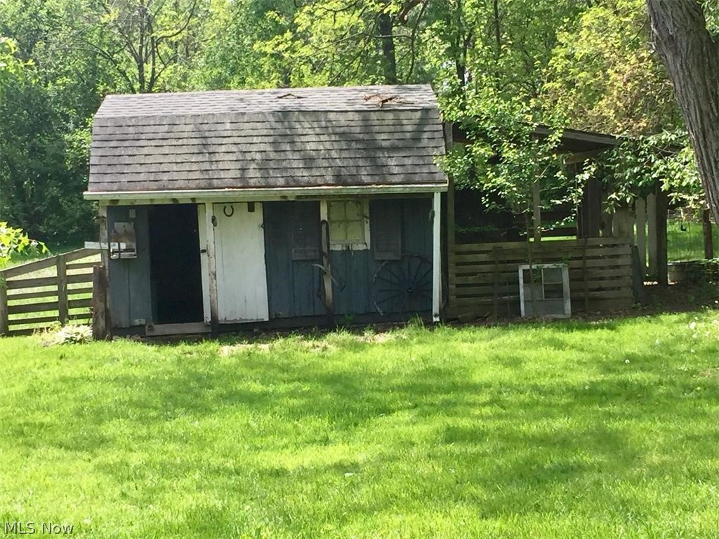 2386 Ridgewood Road Medina, OH 44256 - Photo 27 of 35 This 14x10 outbulding w/covered outdoor space has a stall and storage room. The owners currently have a sheep and chickens which also live and roam the property. A horse would find this a wonderful place to be as well.
