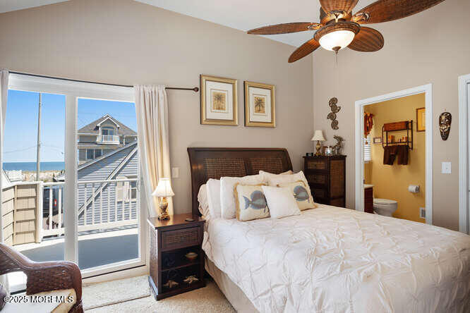 55 Barnegat Way Lavallette, NJ 08735 - Photo 14 of 26 a bedroom with a bed and a chandelier