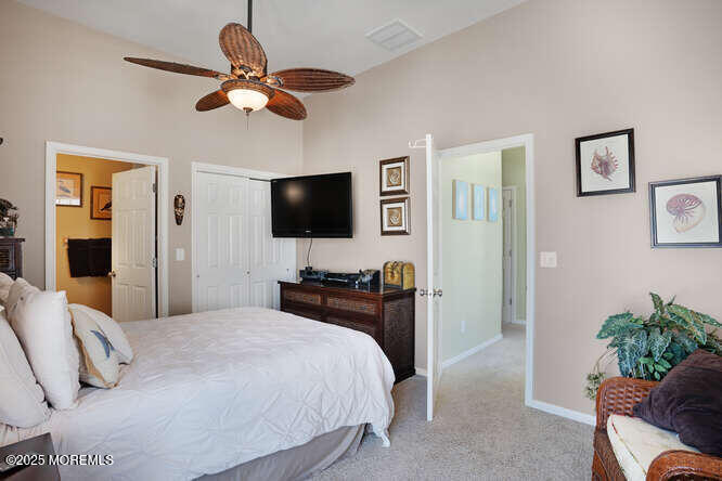 55 Barnegat Way Lavallette, NJ 08735 - Photo 15 of 26 a bedroom with a bed and a flat screen tv