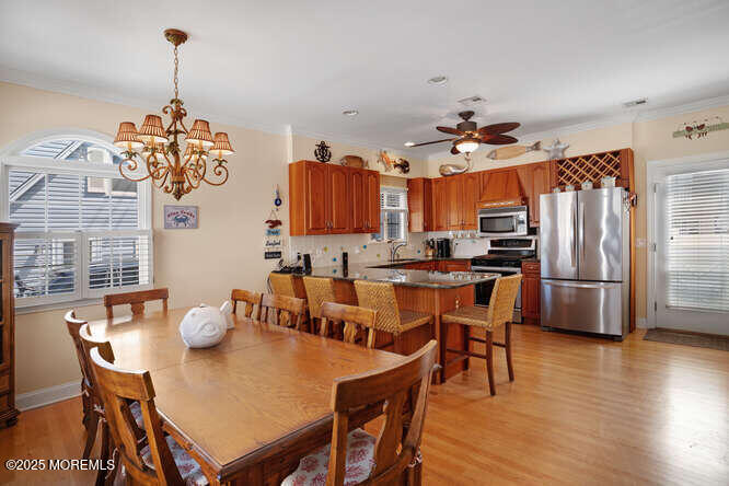 55 Barnegat Way Lavallette, NJ 08735 - Photo 2 of 26 a view of a dining room with furniture window and wooden floor