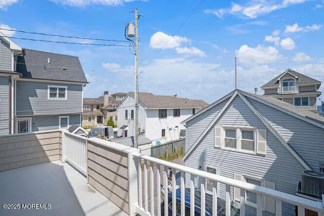 a view of a house with a yard and balcony