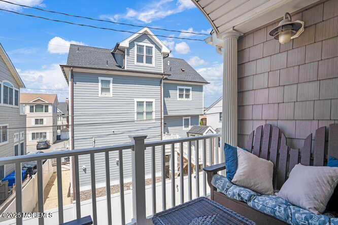 55 Barnegat Way Lavallette, NJ 08735 - Photo 22 of 26 a view of a brick house with a roof deck