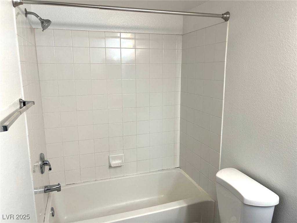 7255 West Sunset Road, Unit 2141 Las Vegas, NV 89113 - Photo 9 of 15 Bathroom featuring a textured wall and shower / bathtub combination
