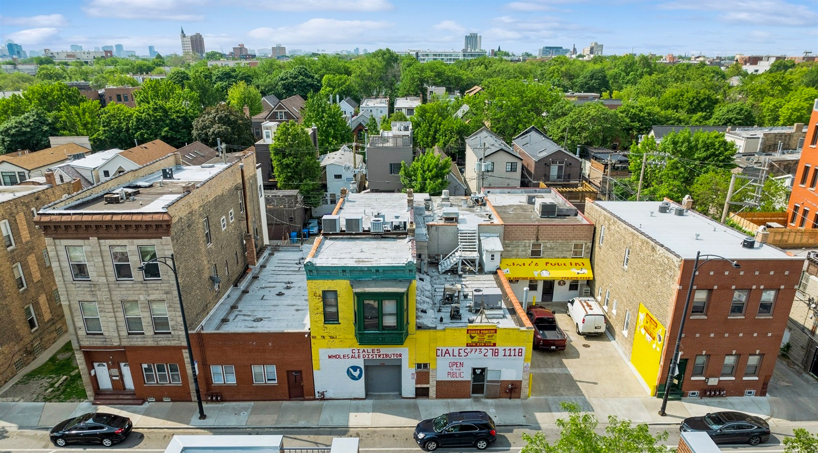 2135 West Armitage Avenue Chicago, IL 60647 - Photo 5 of 9 an aerial view of residential houses with yard and swimming pool