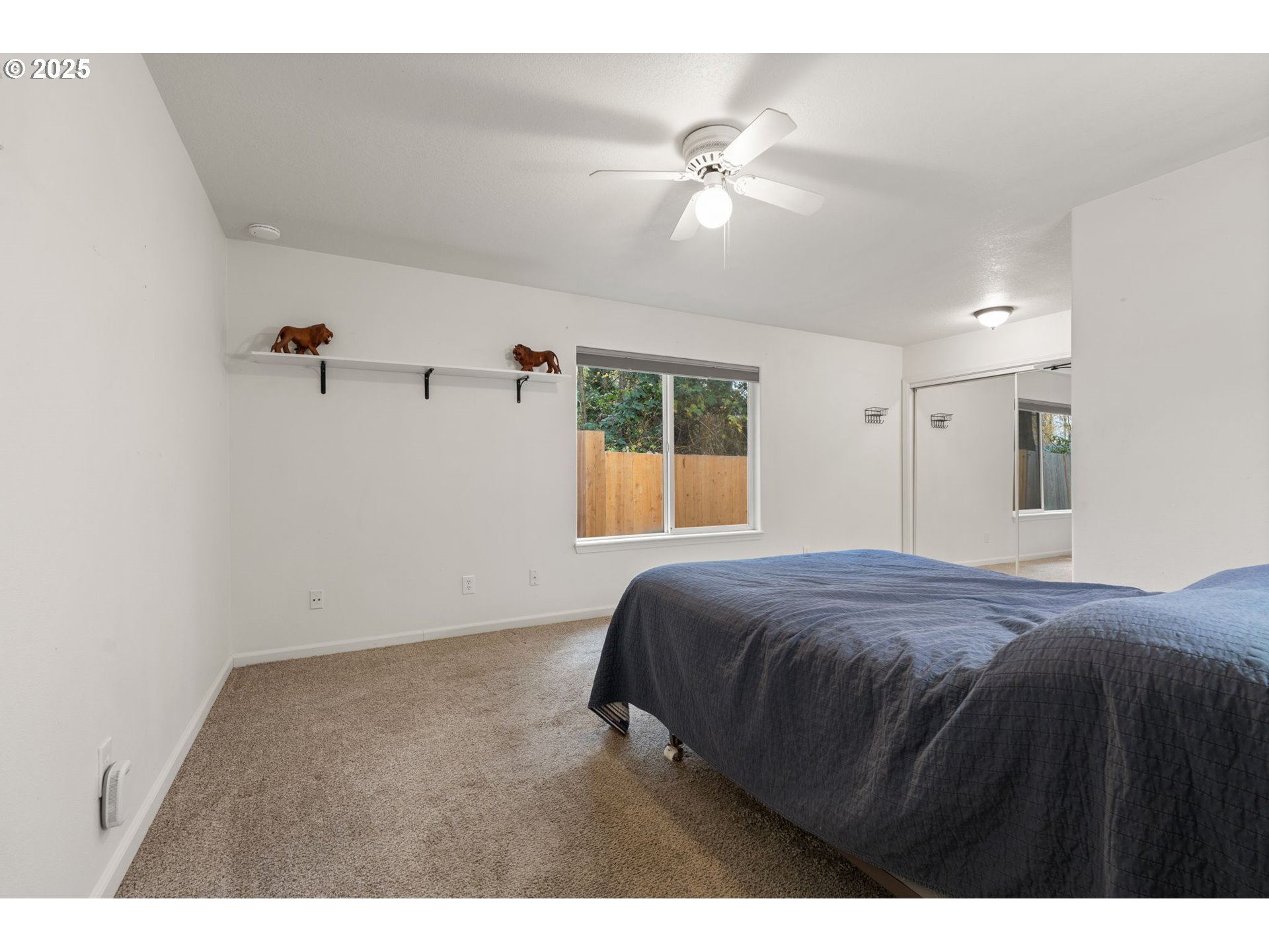 618 Northeast Faloma Road Portland, OR 97211 - Photo 14 of 24 a bedroom with a bed and a chandelier