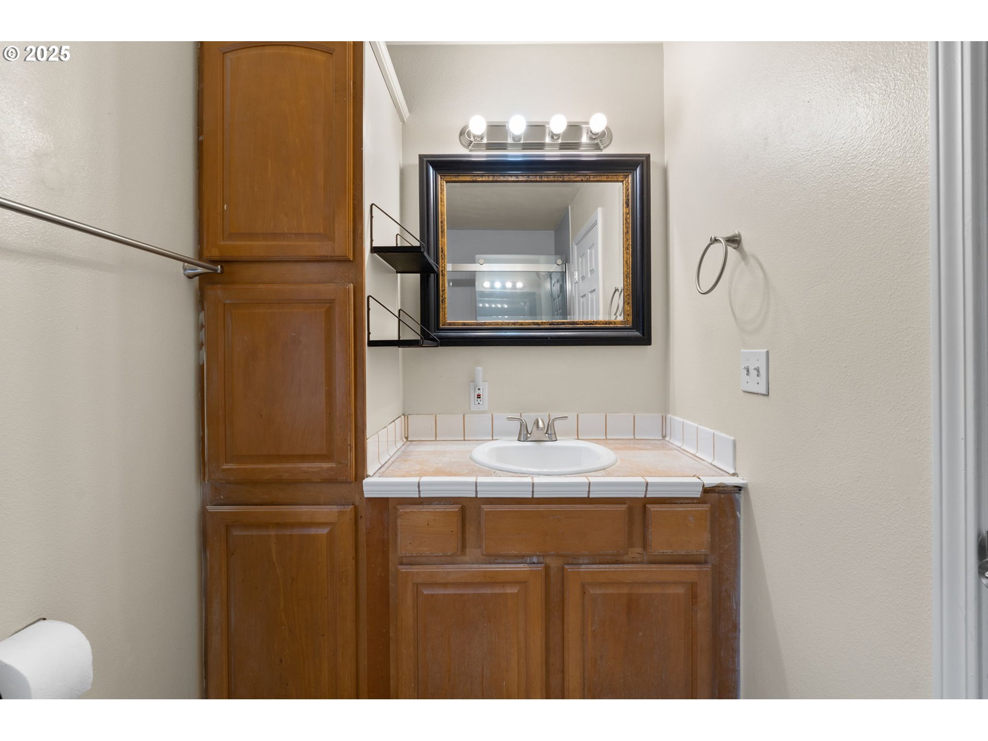 618 Northeast Faloma Road Portland, OR 97211 - Photo 15 of 24 a bathroom with a sink and a mirror