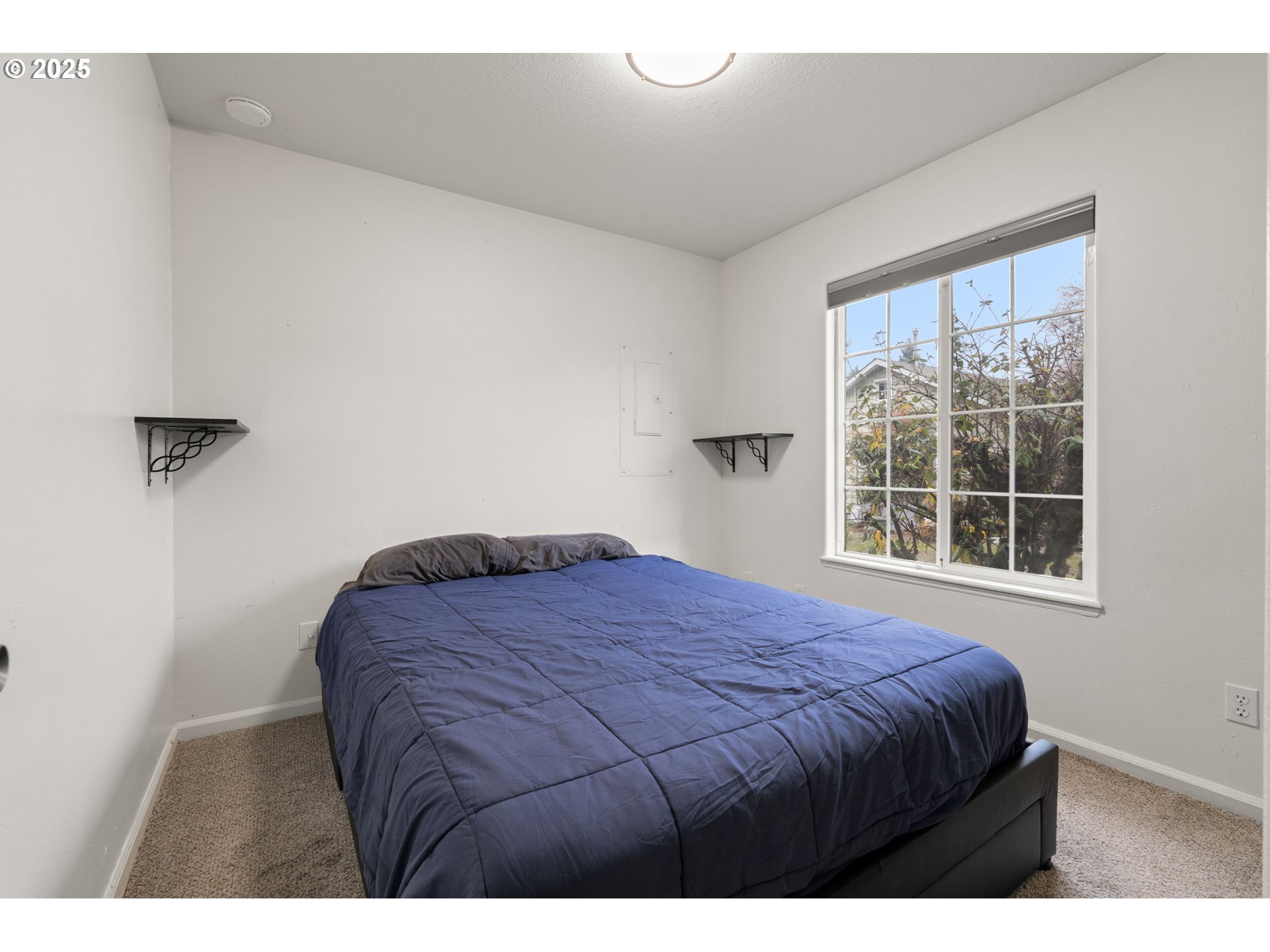 618 Northeast Faloma Road Portland, OR 97211 - Photo 17 of 24 a bedroom with a bed window and mirror