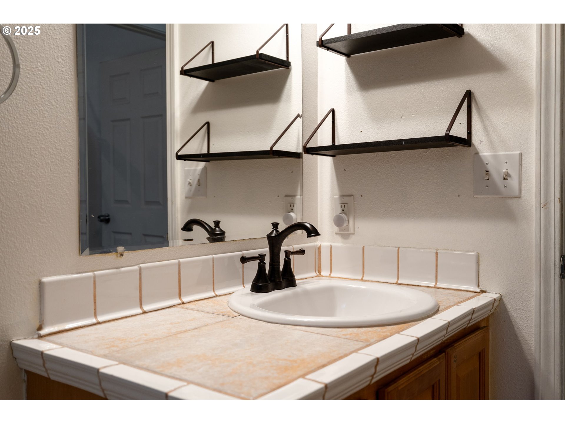 618 Northeast Faloma Road Portland, OR 97211 - Photo 20 of 24 a kitchen with a sink cabinets and a wooden floor