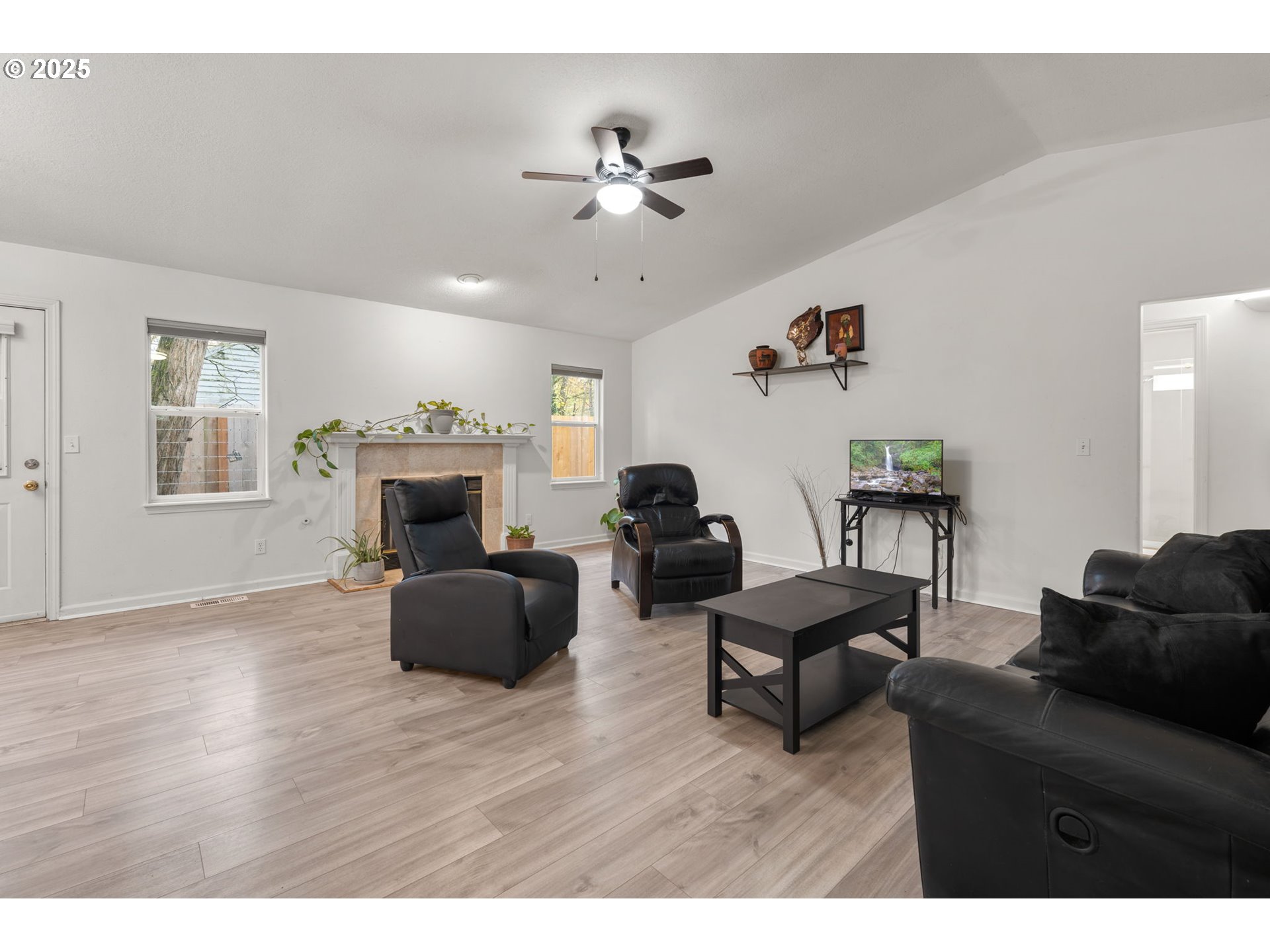 618 Northeast Faloma Road Portland, OR 97211 - Photo 5 of 24 a living room with furniture and a fireplace