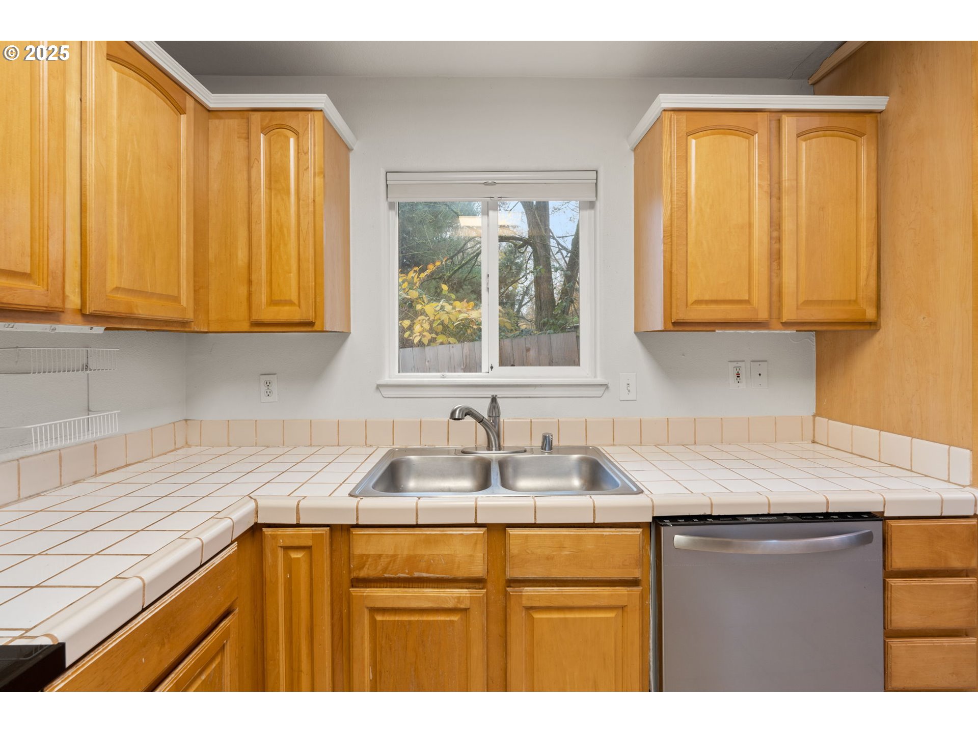 618 Northeast Faloma Road Portland, OR 97211 - Photo 10 of 24 a kitchen with granite countertop a sink and a window