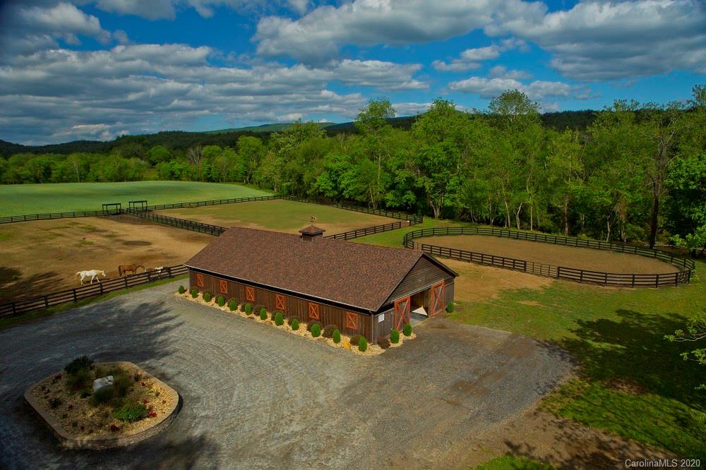 503 Equestrian Drive Lenoir, NC 28645 - Photo 11 of 11 a view of a tennis ground with large trees