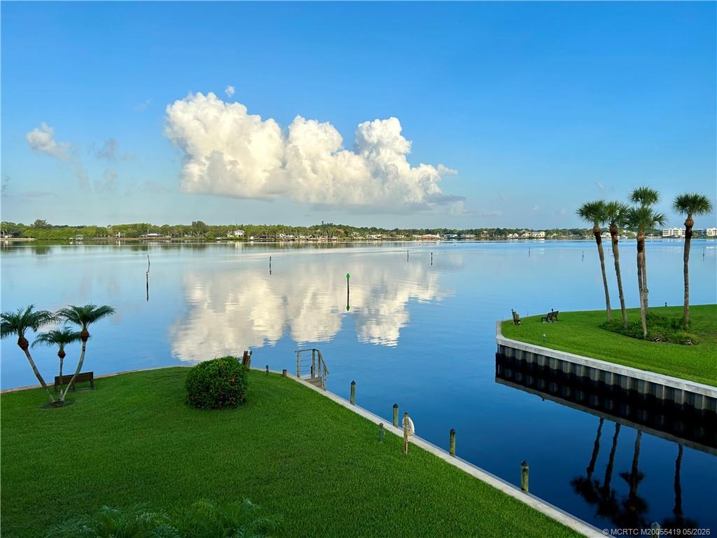 1950 Southwest Palm City Road, Unit 14305 Stuart, FL 34994 - Photo 7 of 70 a view of a lake with a big yard