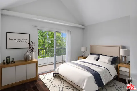 a bedroom with a large bed and a large window