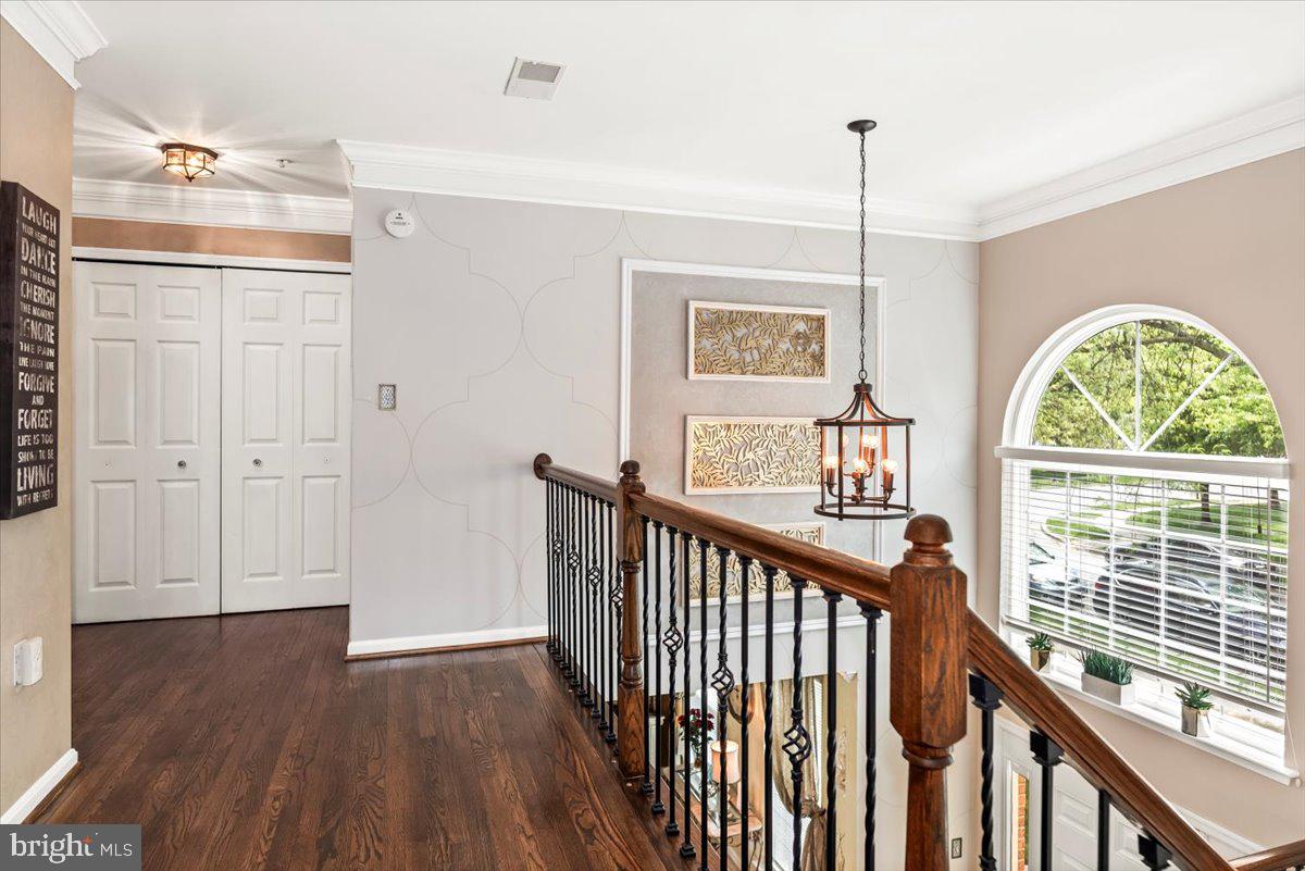 16308 Eddinger Road Bowie, MD 20716 - Photo 19 of 45 a view of a hallway with wooden floor and windows