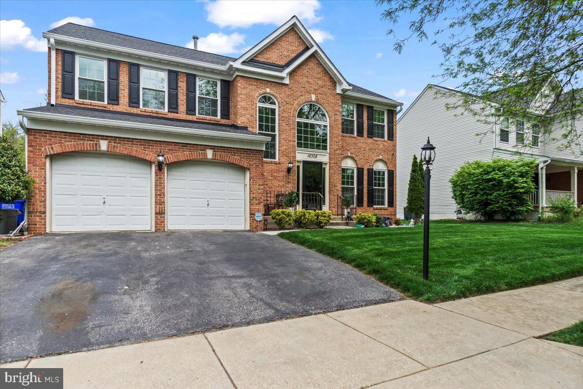 16308 Eddinger Road Bowie, MD 20716 - Photo 2 of 45 front view of a house with a yard