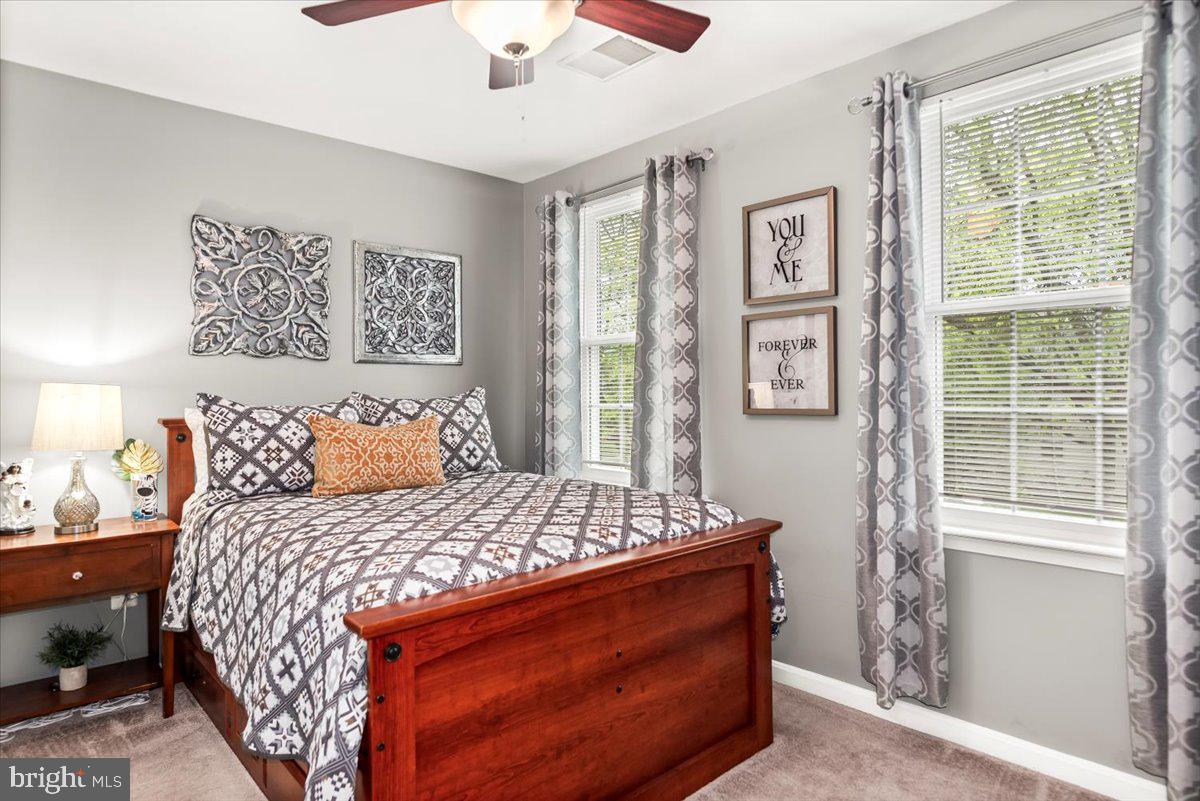 16308 Eddinger Road Bowie, MD 20716 - Photo 24 of 45 a bedroom with a bed and a window