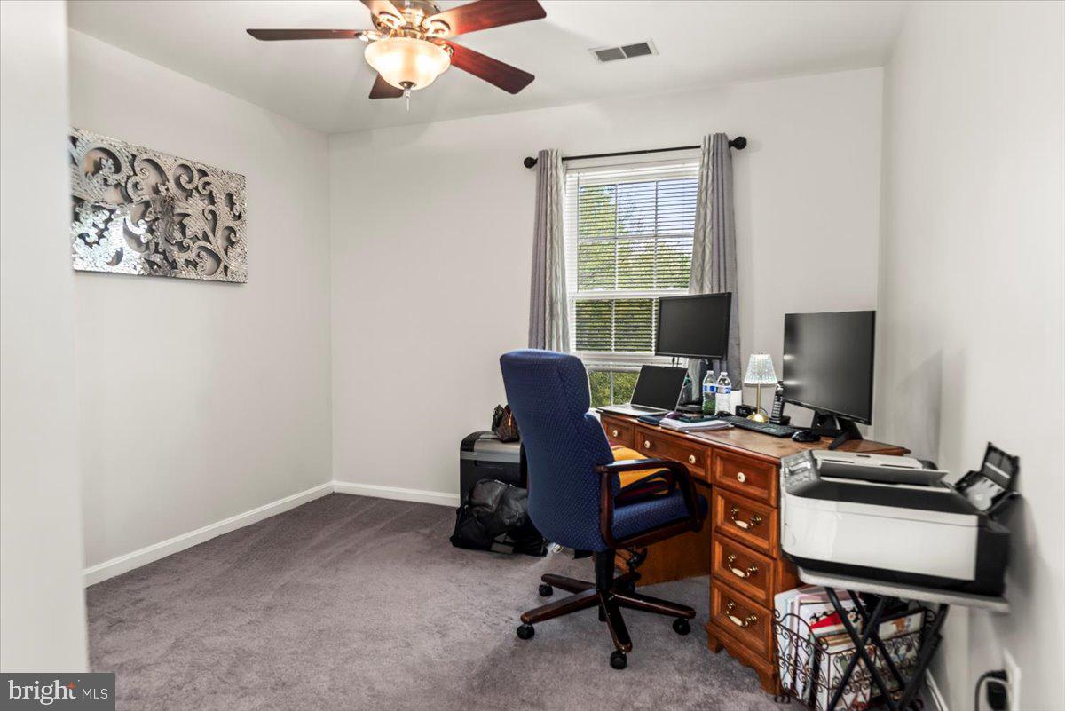 16308 Eddinger Road Bowie, MD 20716 - Photo 25 of 45 a view of a workspace with furniture and a window