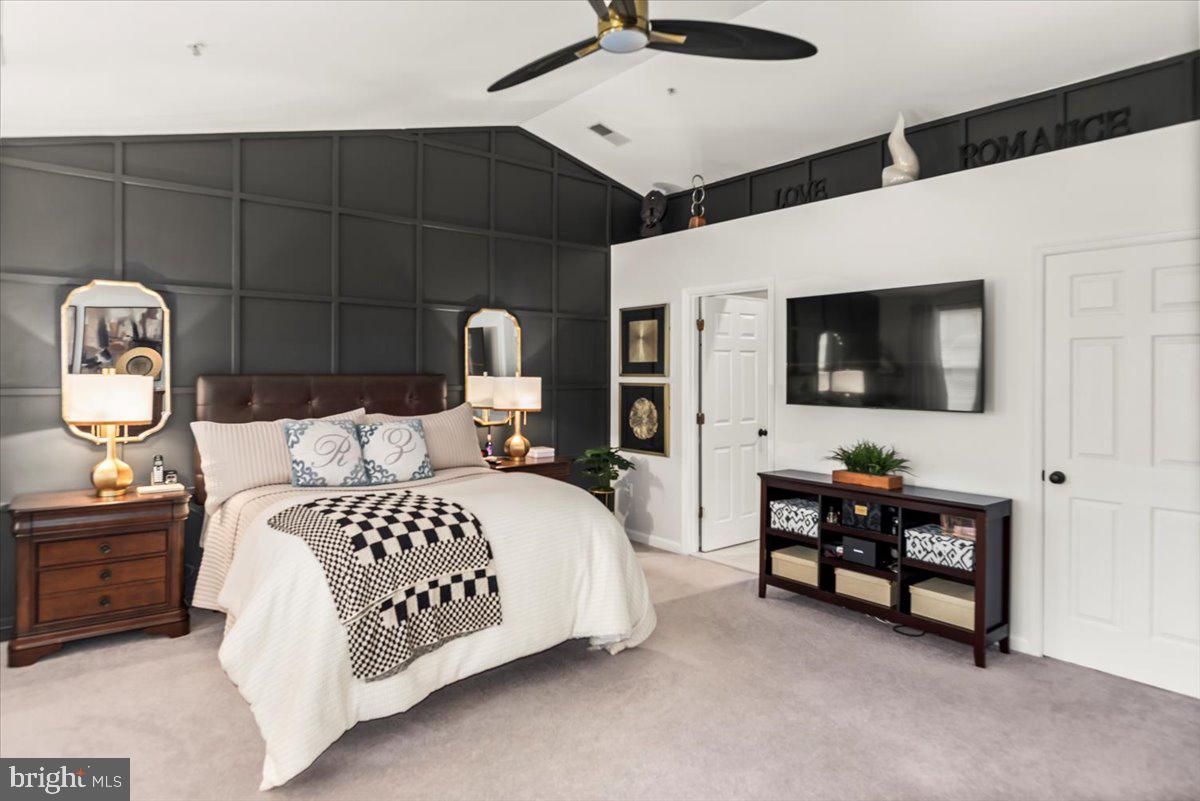 16308 Eddinger Road Bowie, MD 20716 - Photo 27 of 45 a bedroom with a bed a flat tv screen and dresser