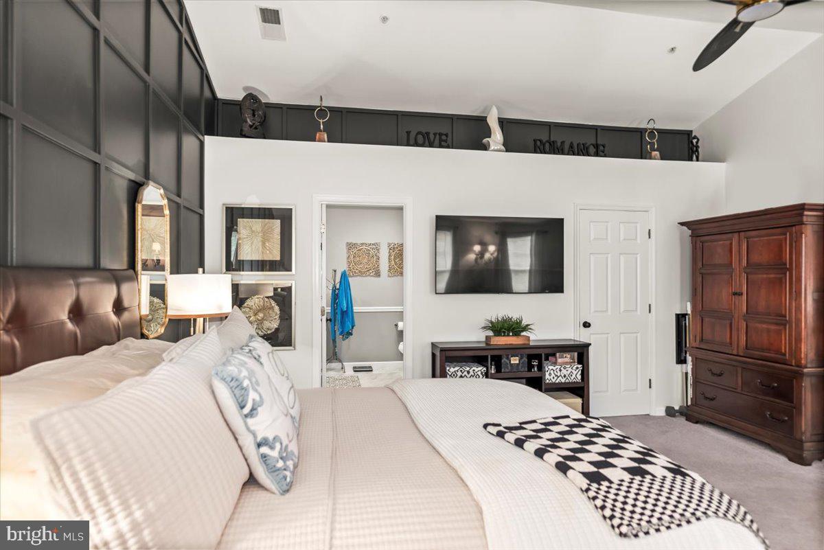 16308 Eddinger Road Bowie, MD 20716 - Photo 29 of 45 a bedroom with a bed a table and chair