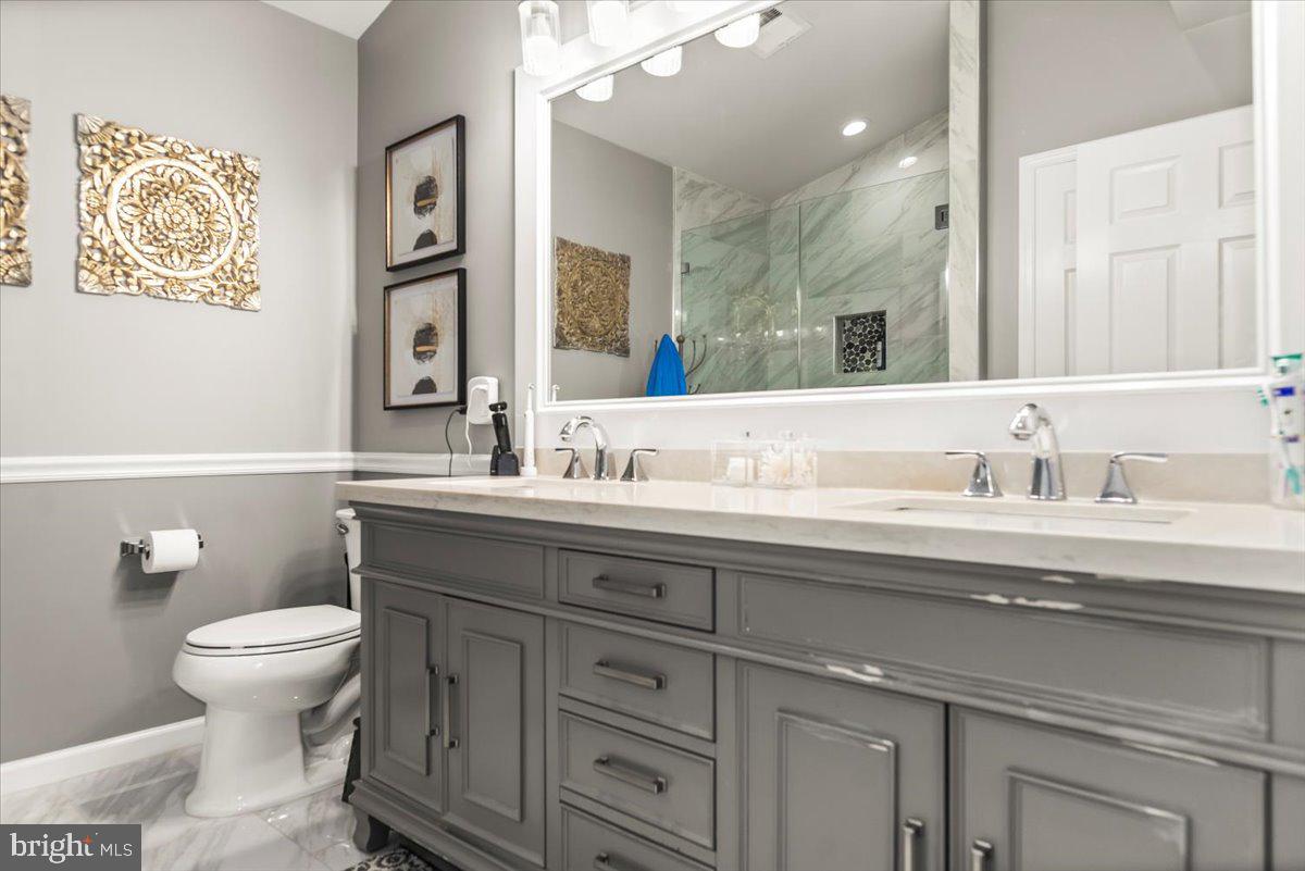 16308 Eddinger Road Bowie, MD 20716 - Photo 31 of 45 a bathroom with a sink and a toilet