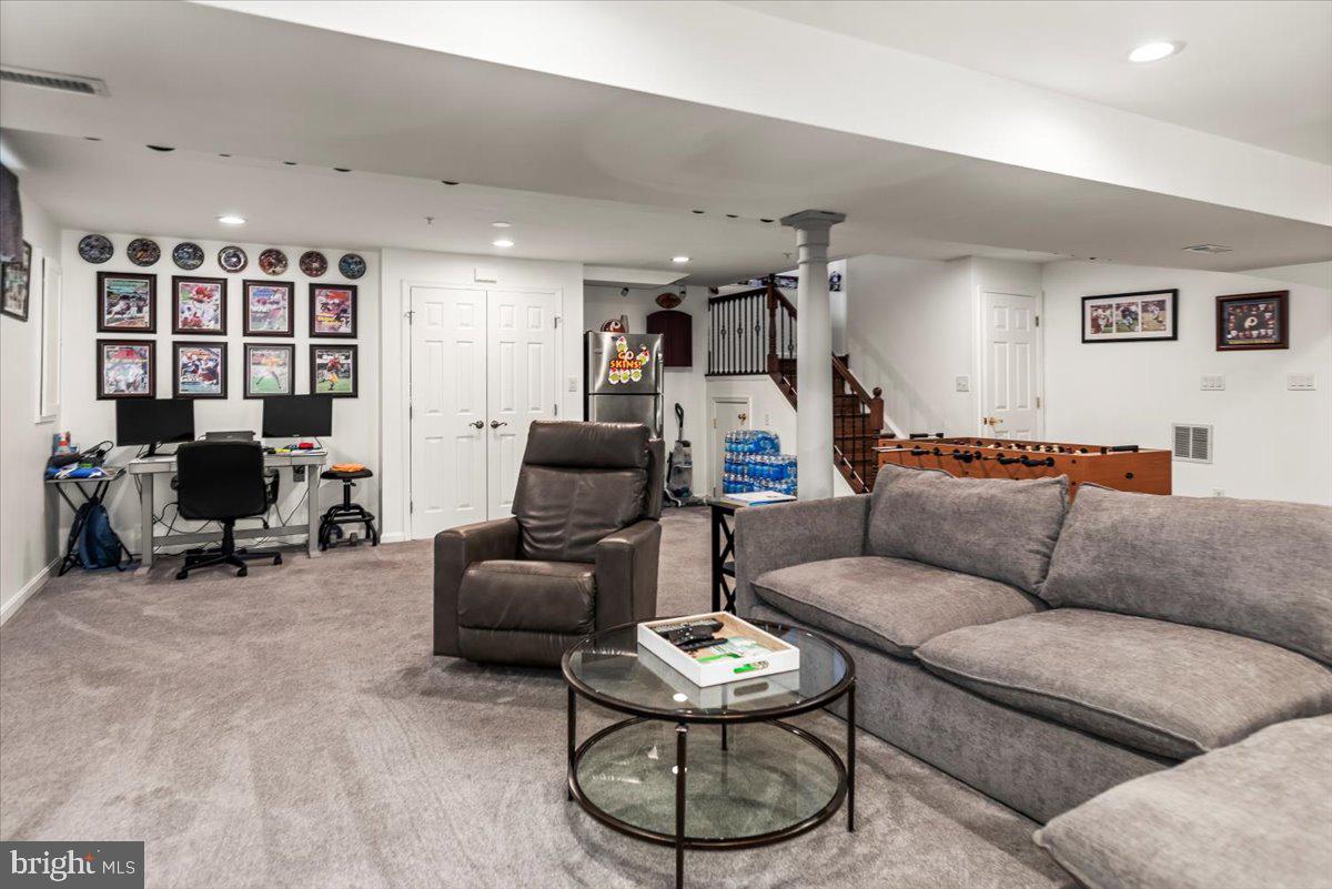 16308 Eddinger Road Bowie, MD 20716 - Photo 35 of 45 a living room with furniture a rug and a large window