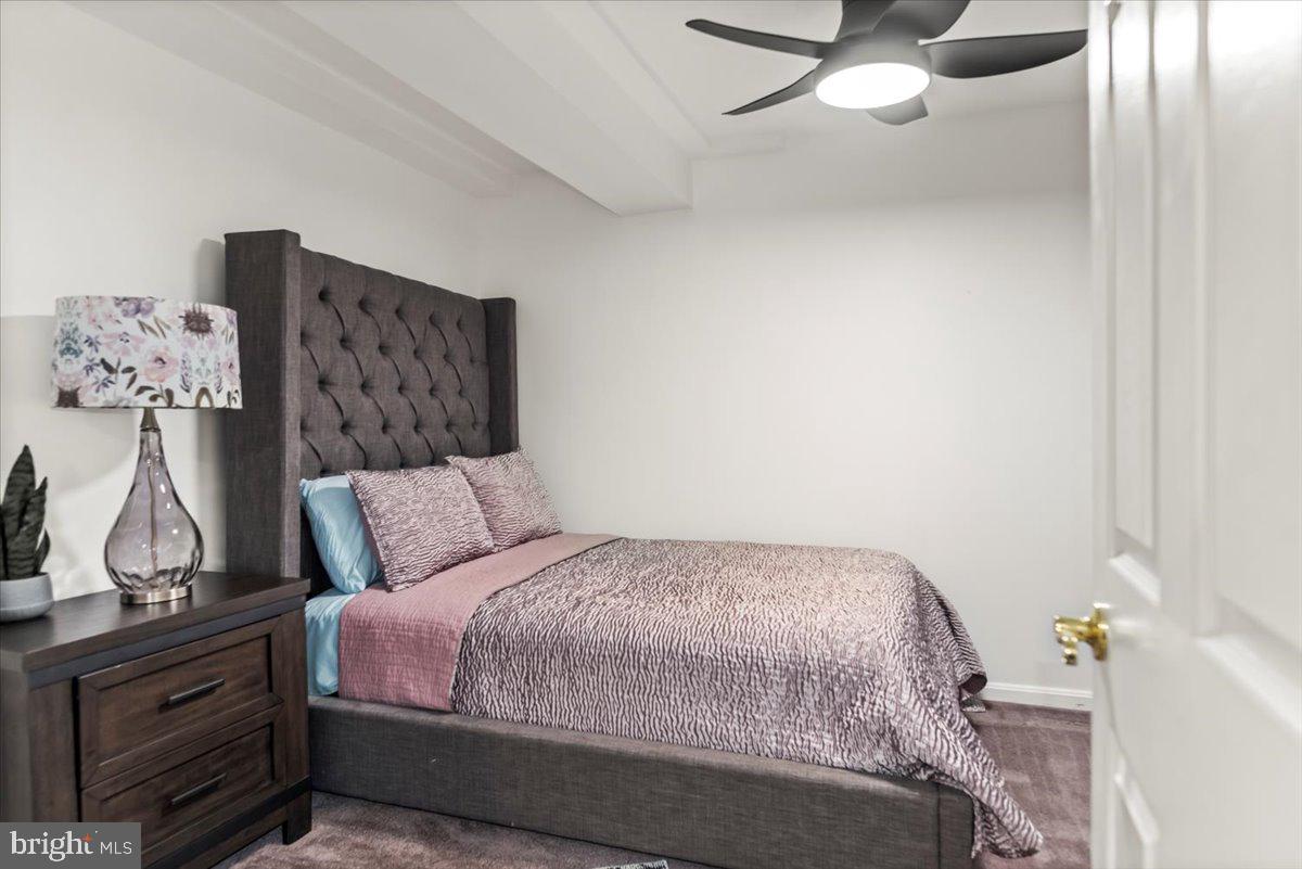 16308 Eddinger Road Bowie, MD 20716 - Photo 41 of 45 a bedroom with a bed and cabinets