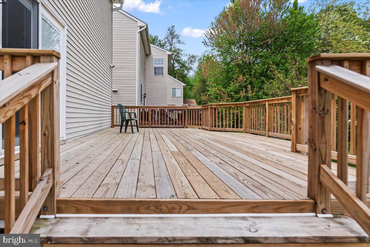 16308 Eddinger Road Bowie, MD 20716 - Photo 43 of 45 a view of backyard with deck and wooden floor