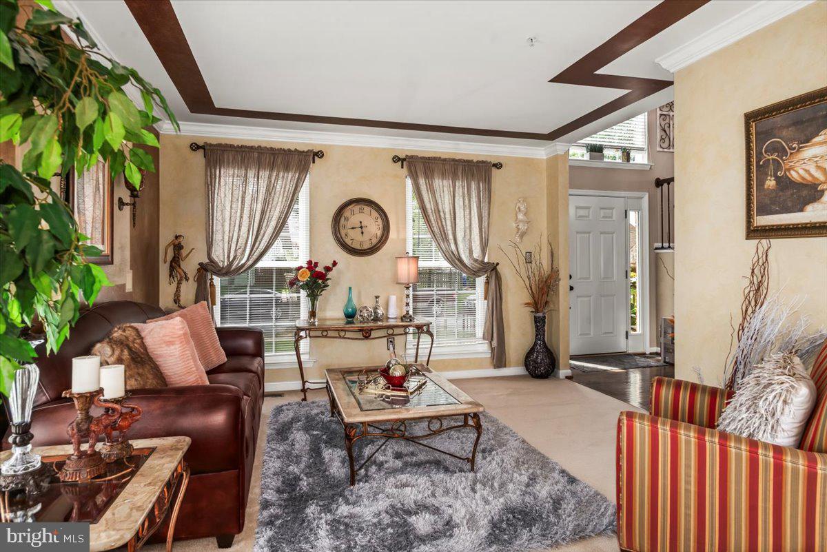 16308 Eddinger Road Bowie, MD 20716 - Photo 5 of 45 a living room with furniture and a large window