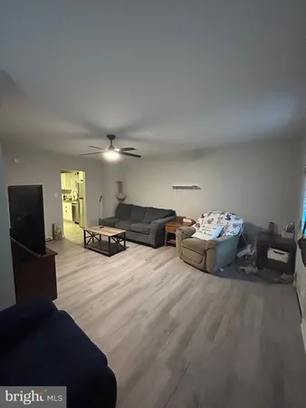 a bedroom with furniture and a flat screen tv