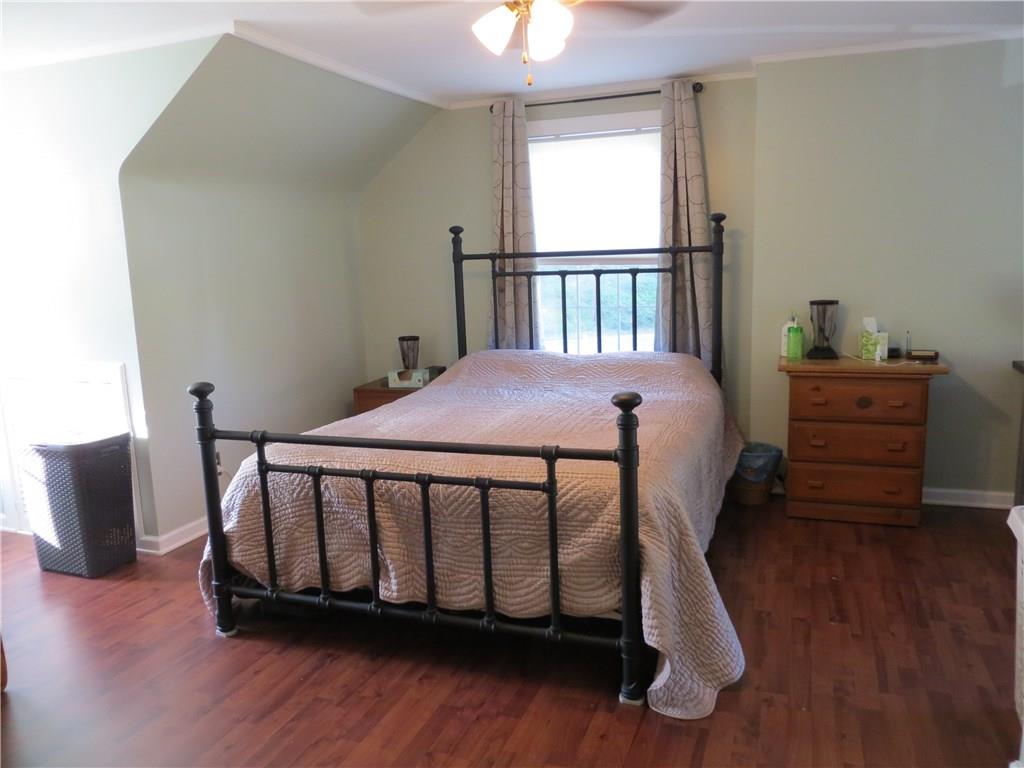 1107 Maple St Extension Coraopolis, PA 15108 - Photo 7 of 13 Master Bedroom w/Laminate Flooring & Ceiling Fan.