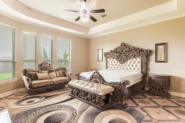 a living room with furniture ceiling fan and a rug