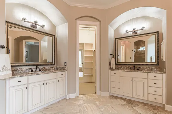 a bathroom with mirror a sink and a mirror