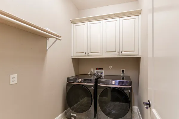 a view of storage and utility room with washer and dryer
