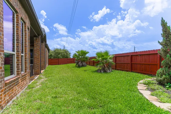 a backyard of a house with lots of green space